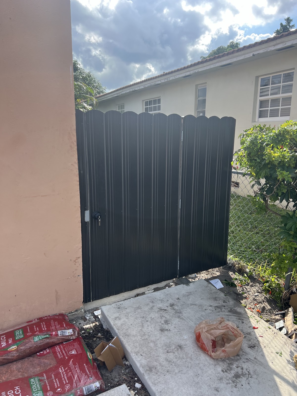 Metal fence and gate installation at residential property